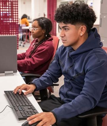 Two students working at computers